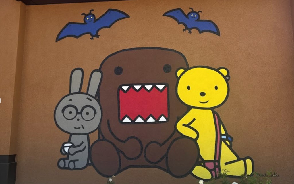 Mural of Domo and friends on the cafe wall