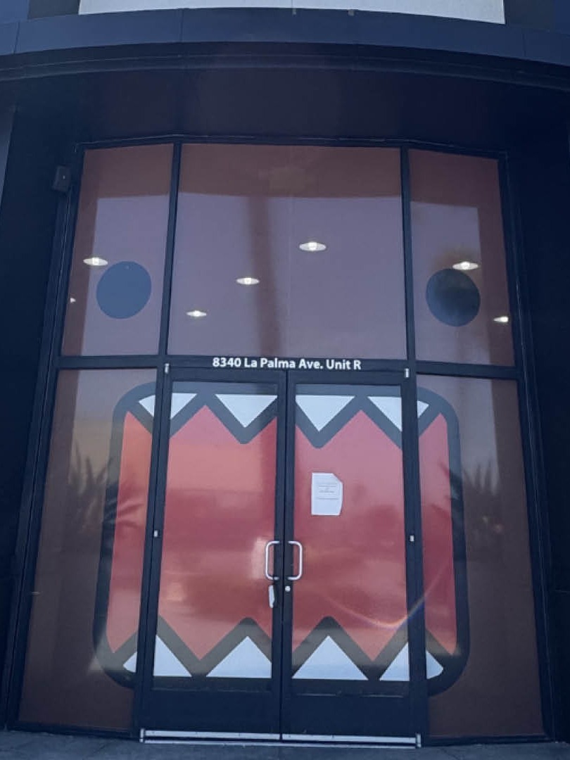Domo Cafe Buena Park entrance doors painted with Domo's face